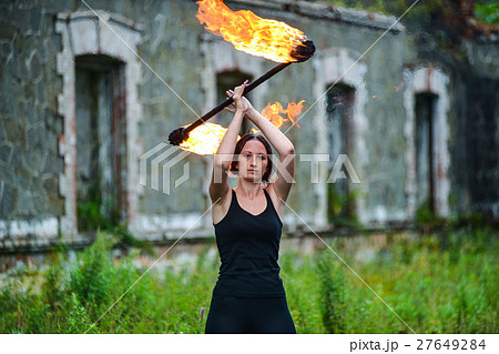 Fire show girl with flaming torches Fire show girl with flaming torches 27649284