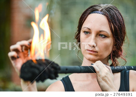 Fire show girl with flaming torches 27649391