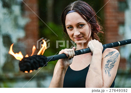 Fire show girl with flaming torches Fire show girl with flaming torches 27649392