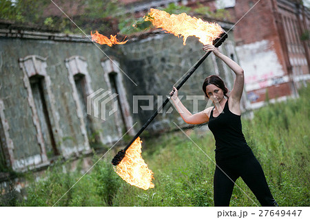 Fire show girl with flaming torches Fire show girl with flaming torches 27649447