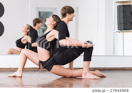 Joyful positive dancers sitting backtoback Joyful positive dancers sitting backtoback 27649968