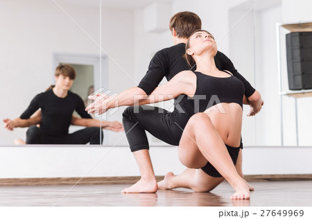 Positive professional dancers working out together Positive professional dancers working out together 27649969