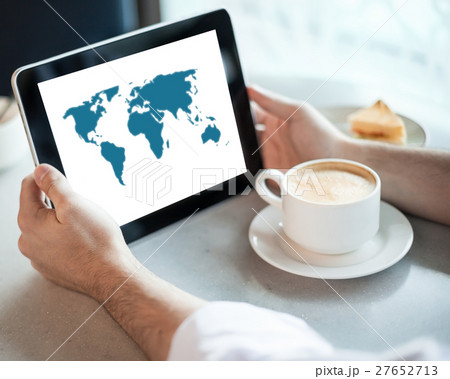 Man holding tablet computer in cafe Man holding tablet computer in cafe 27652713
