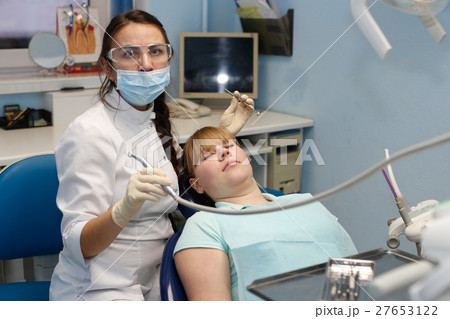 Patient at a reception at the dentist Patient at a reception at the dentist 27653122