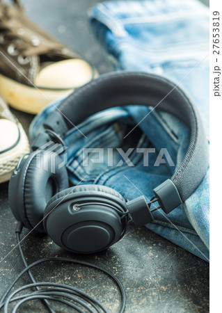 Headphones and blue jeans. Headphones and blue jeans. 27653819