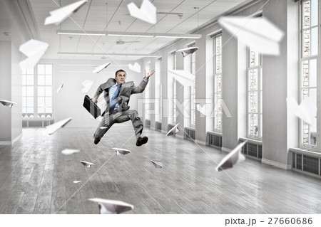 Jumping businessman in office 27660686