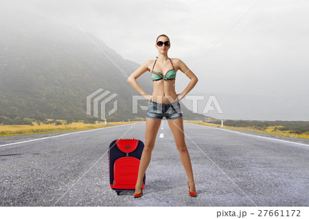 Hitch hiker woman on road 27661172