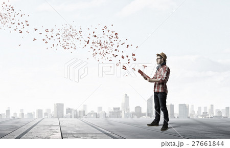Hipster guy with book 27661844