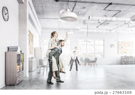 Businesswoman riding colleague back Businesswoman riding colleague back 27663509