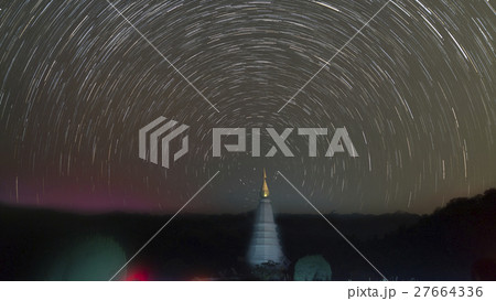 view of buddhist pagoda and startrail in galaxy 27664336