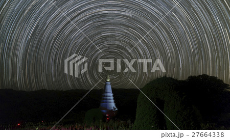 view of buddhist pagoda and startrail in galaxy 27664338