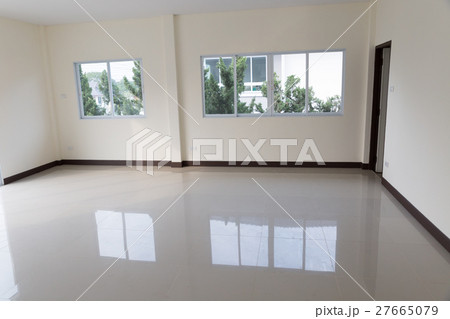 room with sliding window and beige tile floor 27665079