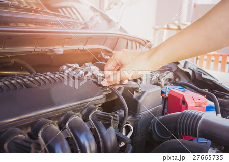 Man check the car engine, vintage effect. Man check the car engine, vintage effect. 27665735
