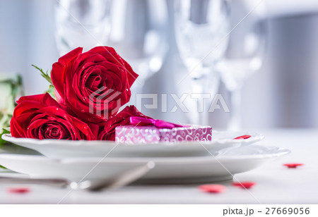 Table setting for valentines day with red roses. Table setting for valentines day with red roses. 27669056