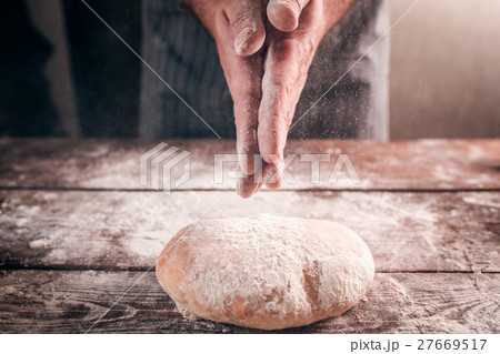 Man slap his hands above fresh bread closeup Man slap his hands above fresh bread closeup 27669517