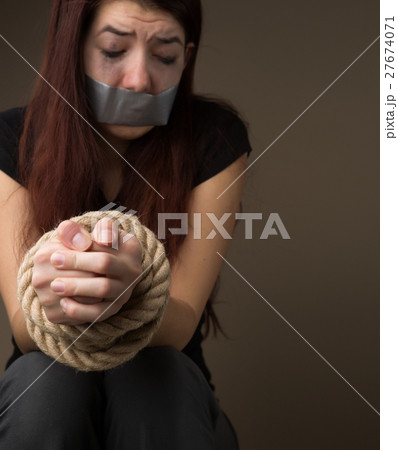 Unhappy girl with sealed mouth Unhappy girl with sealed mouth 27674071