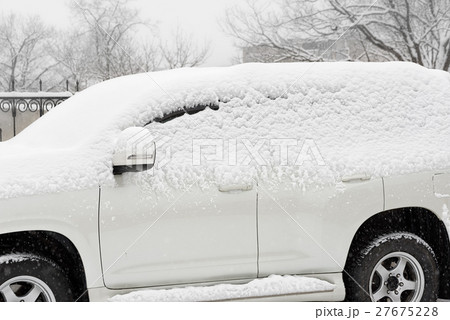 Car in the snow 27675228
