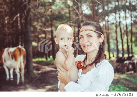 mother with baby in the woods mother with baby in the woods 27675303