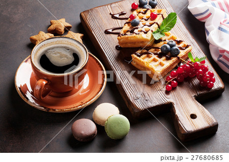 Coffee, sweets and waffles with berries 27680685