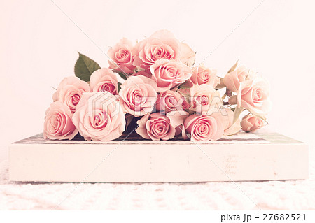 Soft pink roses and vintage books 27682521