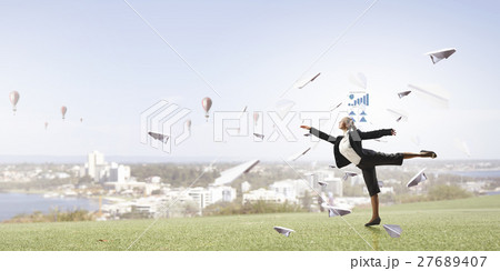 Dancing businesswoman outdoors Dancing businesswoman outdoors 27689407