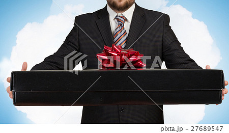 Businessman hold gift box 27689547