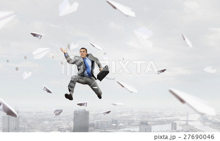 Dancing businesswoman outdoors 27690046