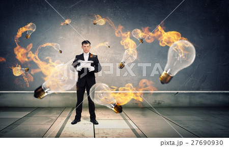 Businessman demonstrating magic Businessman demonstrating magic 27690930