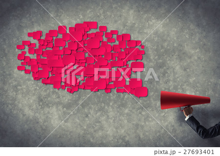 Hand of businesswoman holding red paper trumpet and speech cloud 27693401