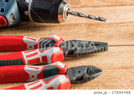 Carpentry tools on wooden surface Carpentry tools on wooden surface 27694498