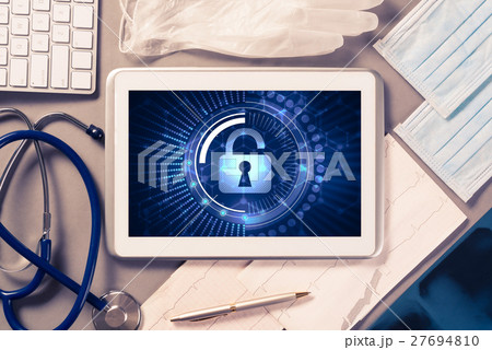 Web security and technology concept with tablet pc on table 27694810