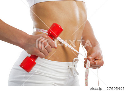 young athletic woman measuring waist young athletic woman measuring waist 27695495