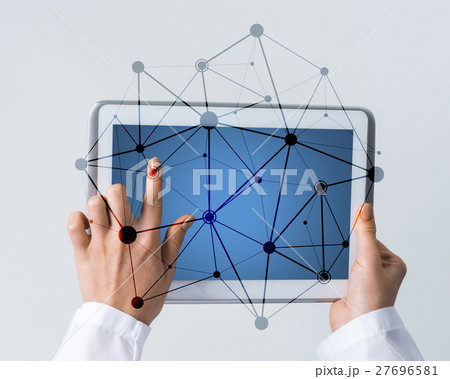 Close of female doctor hands working with tablet pc computer Close of female doctor hands working with tablet pc computer 27696581