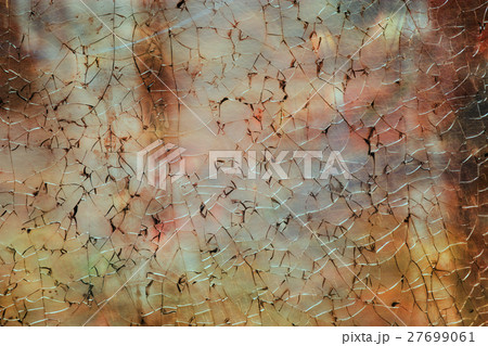 Broken and cracked glass on burnt background 27699061