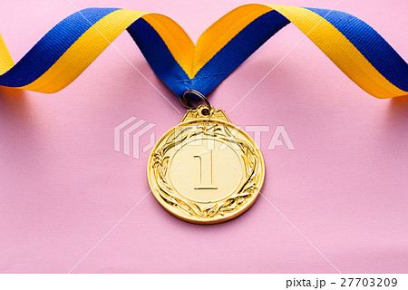 Close-up studio shot of number one golden medal Close-up studio shot of number one golden medal 27703209