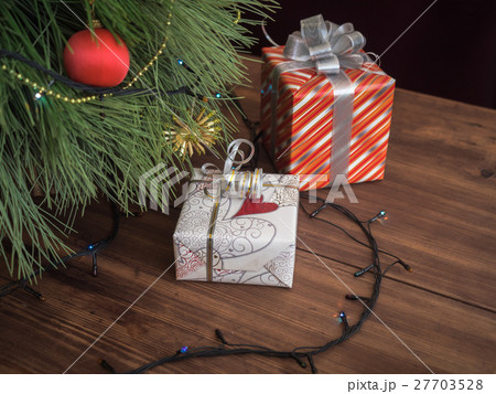 Green Christmas tree decorated with toys and Green Christmas tree decorated with toys and 27703528