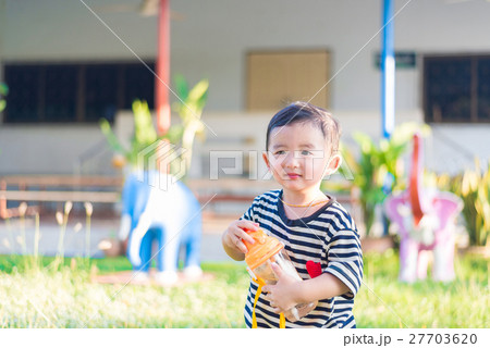 Asian baby boy drink with water bottle at outdoor 27703620