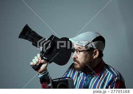 Bearded man two old retro film camera Bearded man two old retro film camera 27705168