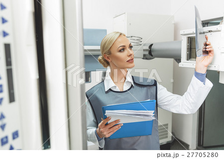 Attentive female doctor in roentgen room 27705280