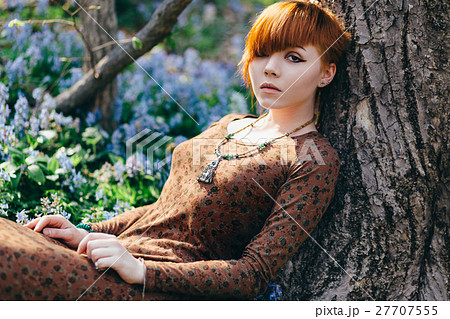 Beautiful young woman in the forest 27707555