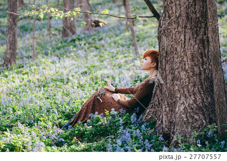 Beautiful young woman in the forest 27707557