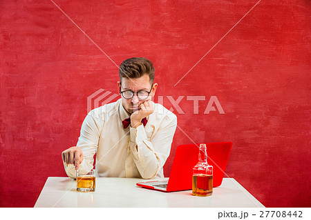 Young funny man with laptop at St. Valentine's Day 27708442