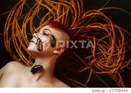 Portrait of a young woman with cockroaches 27709444