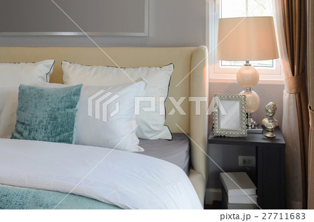 bedroom interior with white and green pillows 27711683