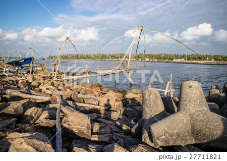 Chinese fishing net on seashore 27711821