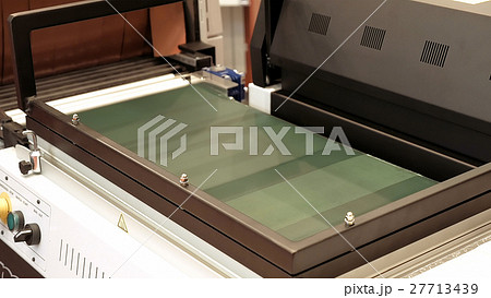 Vacuum package machine on conveyor belt 27713439