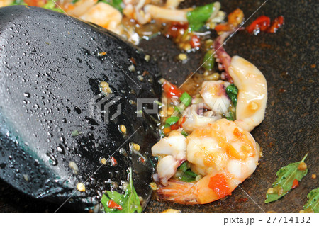 Spicy fried shrimp with basil leaves in pan Spicy fried shrimp with basil leaves in pan 27714132
