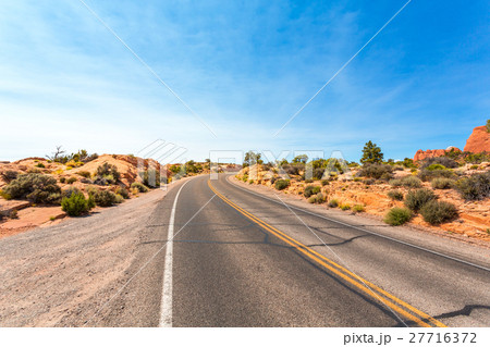 Desert valley road. 27716372