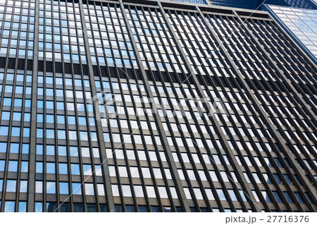 Closeup of glass and concret building. Closeup of glass and concret building. 27716376