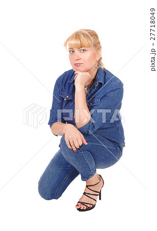 Woman kneeling on floor. Woman kneeling on floor. 27718049